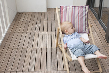 Baby reclining on lounge chair