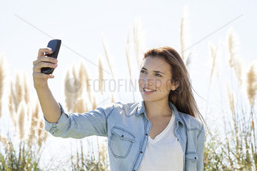 Woman posing for a selfie outdoors