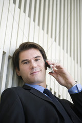 Businessman using cell phone  portrait