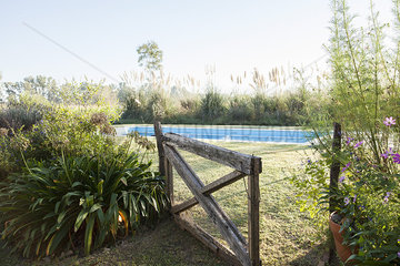Open gate leading to swimming pool