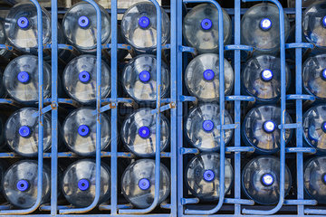 Rows of water bottles arranged in warehouse