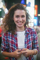 Young woman in Times Square  New York City  New York  USA