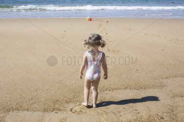 Little girl at the beach  rear view