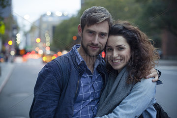 Couple on city street in the evening  portrait