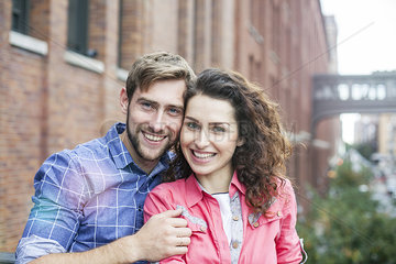 Couple smiling together outdoors  portrait