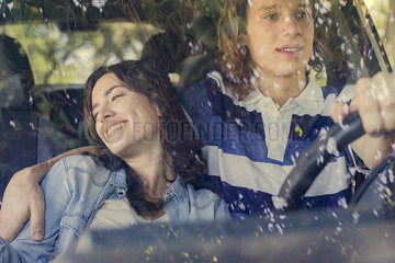 Couple going on road trip in car