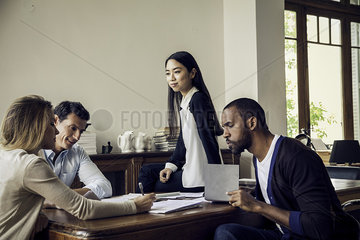 Colleagues working together in casual office