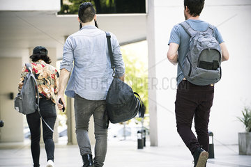 College students walking on campus  rear view