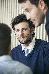 Businessman smiling in meeting  portrait