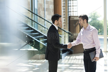 Business associates exchange greetings
