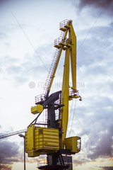 Construction crane against morning sky