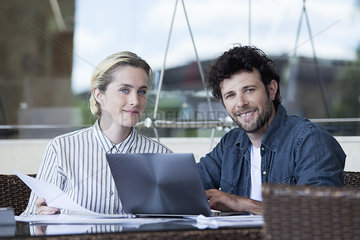 Couple using laptop computer together