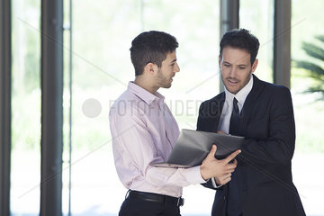 Businessman sharing idea with associate