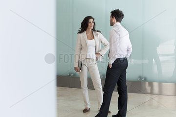 Businesswoman talking to male colleague