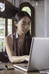 Young woman working on laptop computer