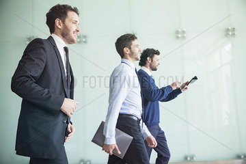 Businessmen walking together with confidence