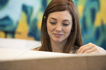 Woman smiling while working