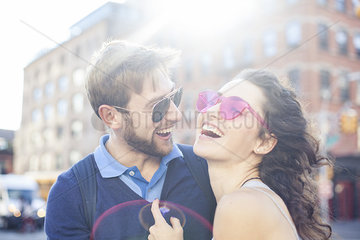 Couple laughing together outdoors