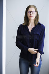 Woman rolling up shirt sleeves
