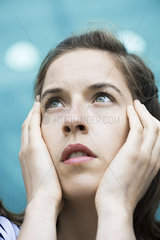 Woman looking up in thought  portrait