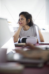 Woman looking bored at work
