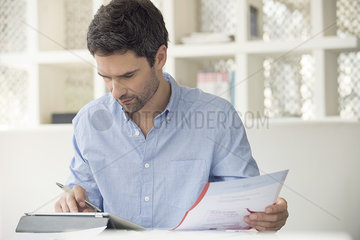 Man using online banking to manage personal finances