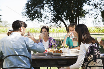 Friends enjoying meal together outdoors