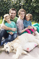 Family with young children and family dog  portrait