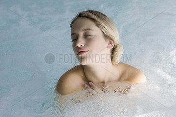 Woman relaxing in jacuzzi