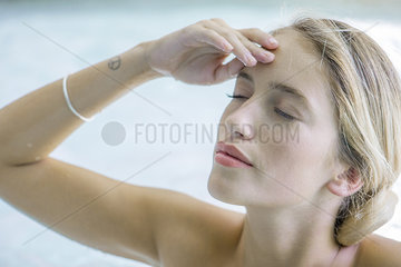 Woman massaging her forehead