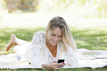 Woman using smartphone in park