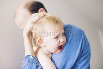 Father comforting crying baby