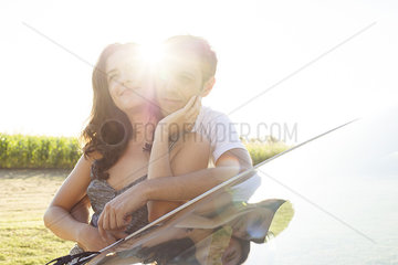 Couple expressing affection for one another while enjoying surrounding natural beauty