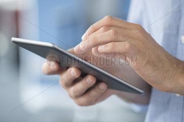 Man using digital tablet  close-up