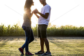 Couple dancing together outdoors