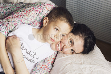 Mother embracing young son  portrait