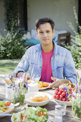 Man enjoying meal outdoors  portrait