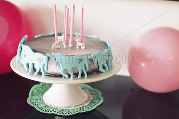 Birthday cake decorated with unicorns