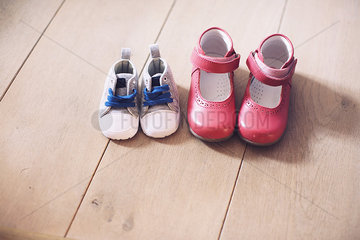 Children's shoes side by side on floor