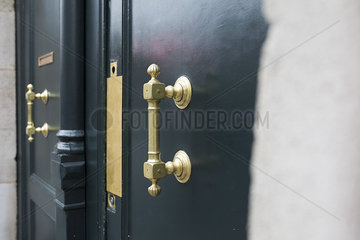 Brass handle on door