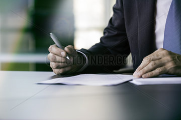 Executive writing letter by hand