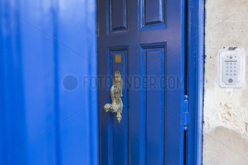 Blue door with brass handle