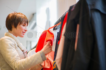 Woman shopping in clothing store