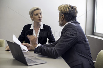 Business woman talking with financial advisor