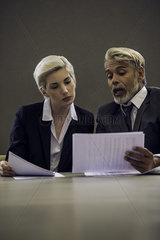 Woman and man reviewing document together