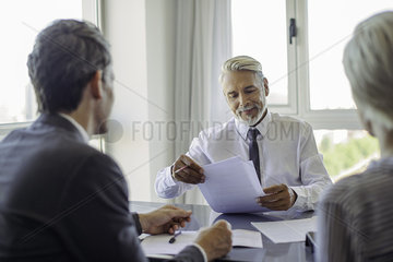 Businessman meeting with couple