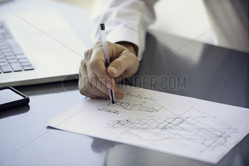 Man working with blueprints