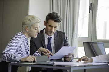 Man and woman reviewing document