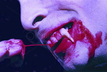 Vampire with blood tooth
