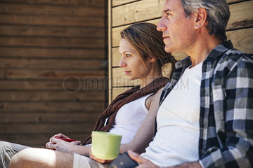 Couple sitting with coffee cups
